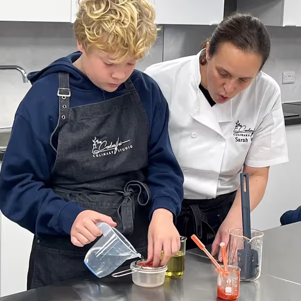 Sarah offering 1:1 assistance at The Cookery Lab